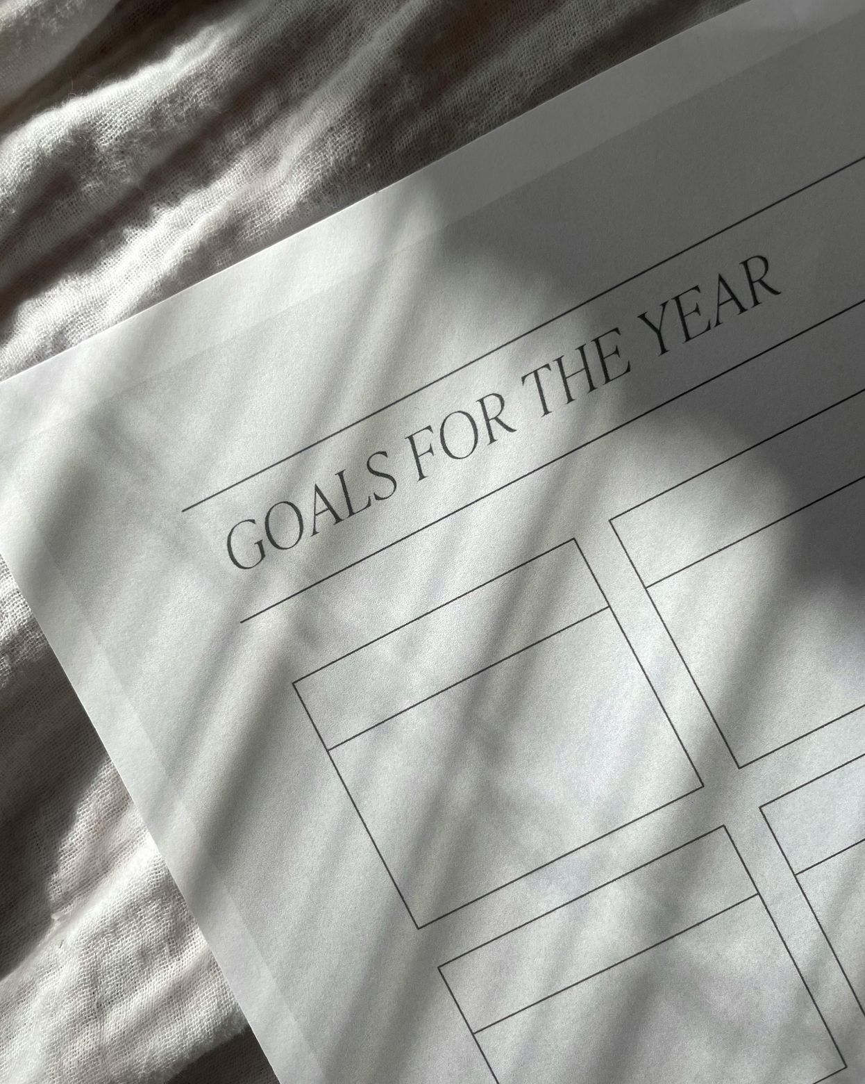 a blank piece of paper titled 'Goals for the Year', inviting you to think about your next big thing